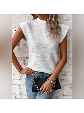White wave pattern designed top with cap sleeves new in bag. Various sizes